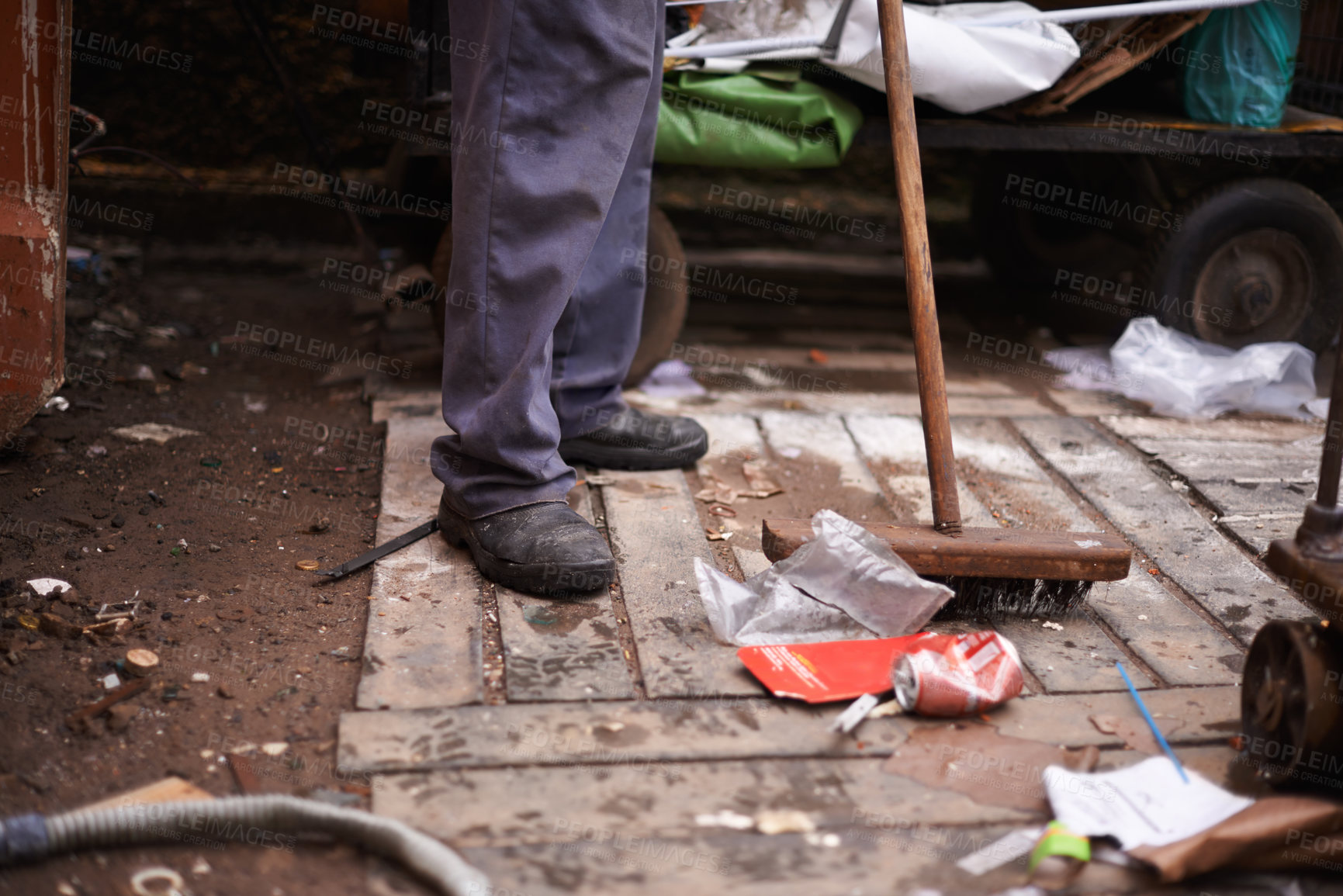 Buy stock photo Legs, broom and sweeping dirt on floor, hygiene and cleaning for sanitation in dirty outdoors. Feet, street cleaner and equipment for mess in town, pollution and person for protection of bacteria