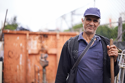 Buy stock photo A cropped portrait of a street sweeper standing with his broom