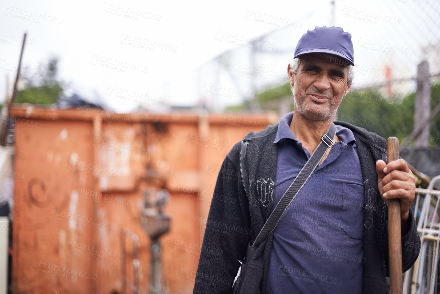 Buy stock photo A cropped portrait of a street sweeper standing with his broom