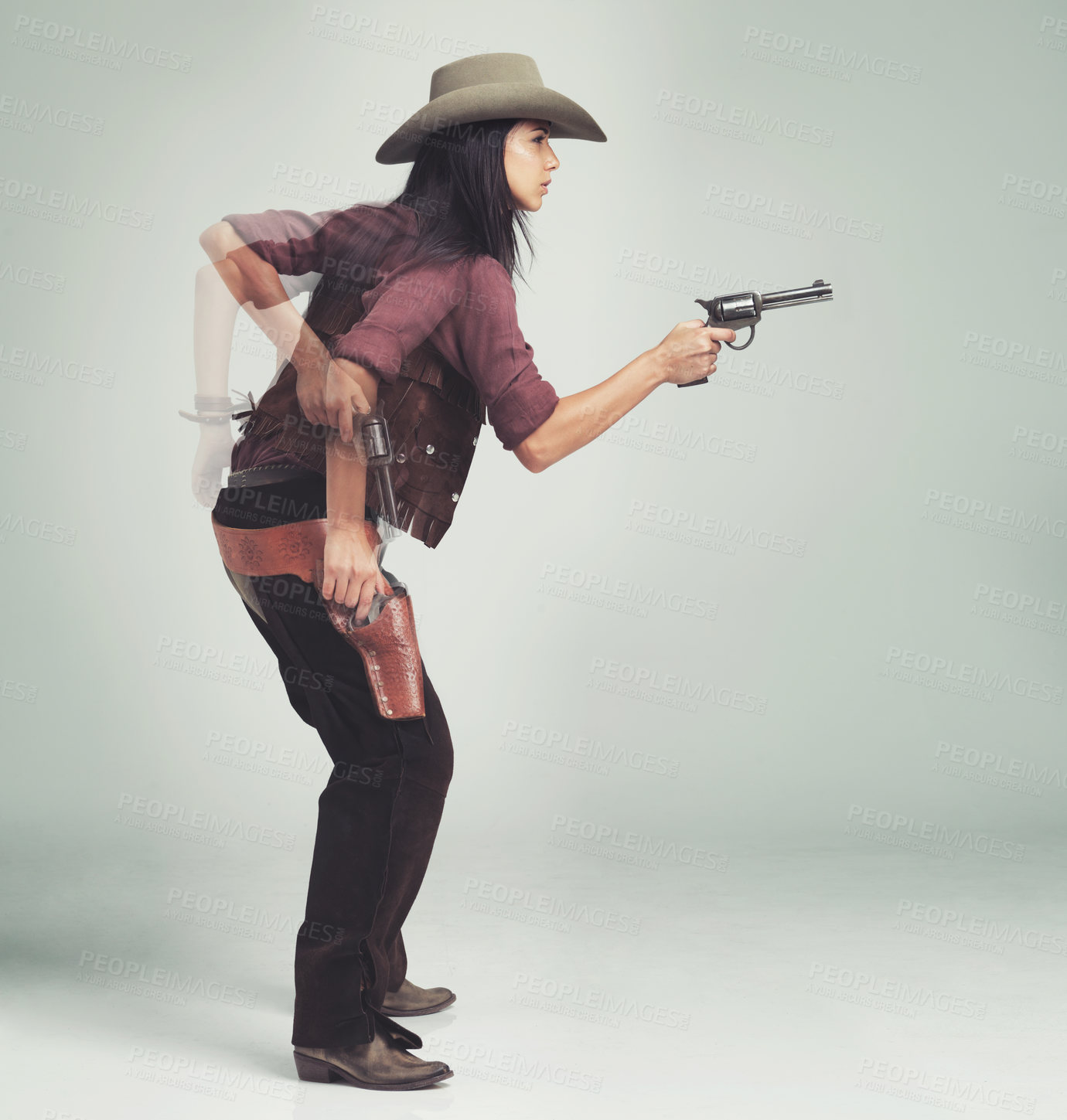 Buy stock photo Western, cowboy and woman with gun in studio for motion, speed and shooting with standing ready. Female person, weapon and serious expression with pistol for character, halloween and costume design