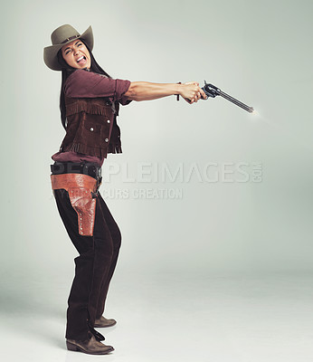 Buy stock photo Cowgirl, woman and shooting gun, weapon or pistol in studio with costume isolated on white background mockup. Western, criminal and female person with revolver, scared or screaming in fear in Texas