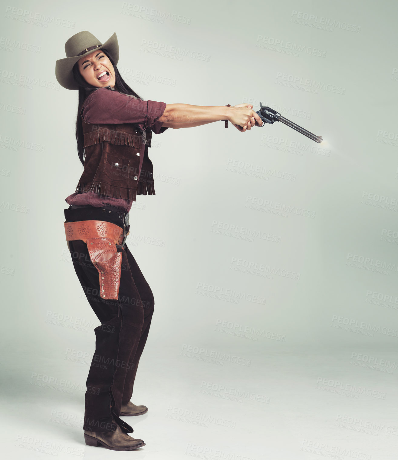 Buy stock photo Cowgirl, woman and shooting gun, weapon or pistol in studio with costume isolated on white background mockup. Western, criminal and female person with revolver, scared or screaming in fear in Texas