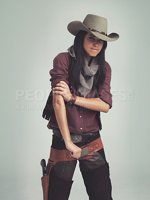 Buy stock photo Western woman, cowgirl and strong in portrait, muscle and costume for tough with confidence. Female person, cowboy hat and clothes from Texas, white background and dress up for strength or proud