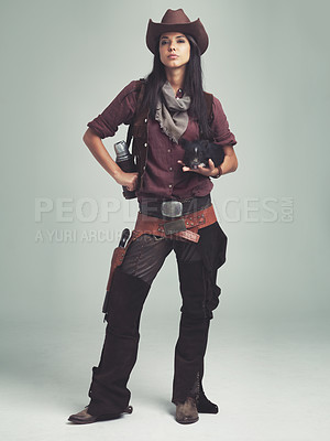 Buy stock photo Woman, fashion and cowboy clothes, confident in portrait in studio, western character with pig and costume on white background. Wild west style, outlaw cosplay and vintage apparel with animal or pet
