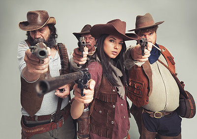 Buy stock photo Bandit group, portrait and cowboys with weapon, aimed and Halloween on white background. Wild western, costume and characters of Texas criminals, comic and vintage for old west theme with studio gun