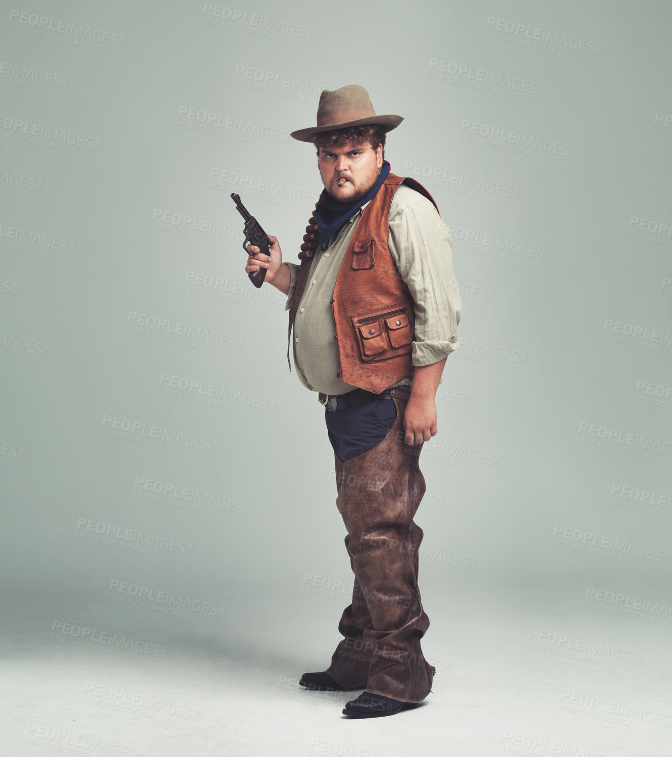 Buy stock photo Portrait, man and cowboy with a gun, serious and proud person on white studio background. Face, model and guy with pistol or firearm with danger or warning with Halloween costume, confidence or Texas