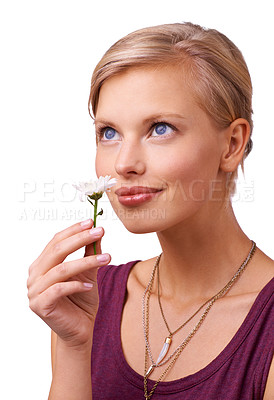 Buy stock photo Studio, young woman and smelling a flower on white background for scent of perfume for botanicals. Model, thinking or creative inspiration with daisy for stress relief or happy idea with floral plant