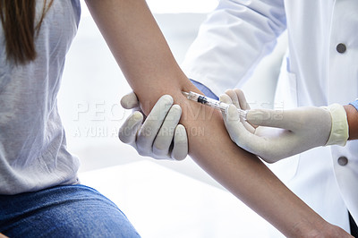 Buy stock photo A doctor giving a woman an injection