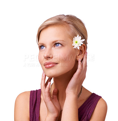Buy stock photo Skincare, thinking and model with beauty or flower with shine, smile or skin treatment in studio. White background, facial glow or female person isolated to relax with natural face, wellness or ideas