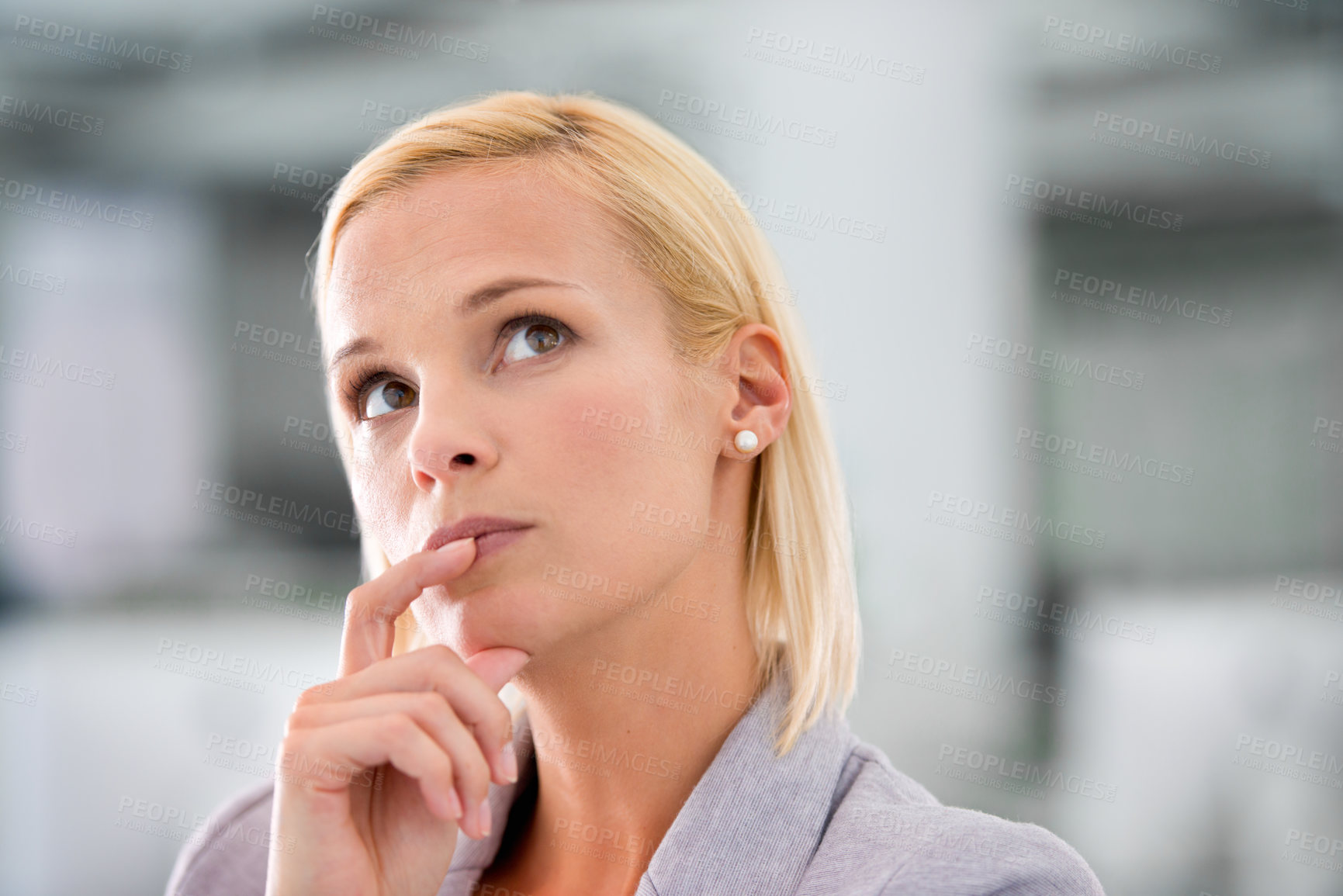 Buy stock photo Cropped shot of an attractive young businesswoman looking thoughtful