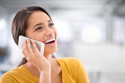 Buy stock photo Cropped shot of an attractive young businesswoman talking on a cellphone