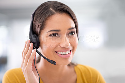 Buy stock photo Shot of an attractive young customer service representative wearing a headset