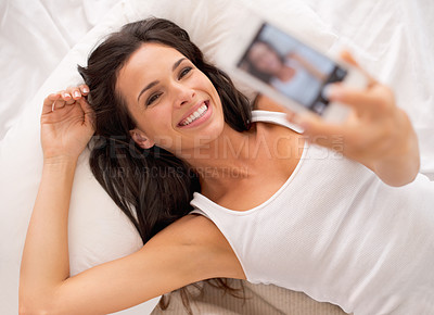 Buy stock photo Woman, selfie and above in bedroom with smile on vacation, hotel or relax for photography on web blog. Girl, person and influencer for profile picture, home and live streaming in bed on social media