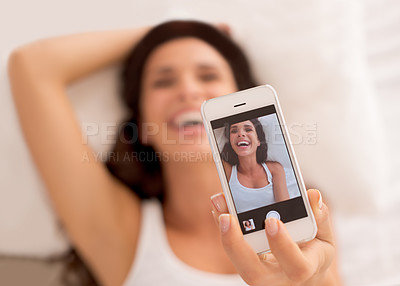 Buy stock photo Woman, selfie and happy with phone screen, bed and relax with photography on web blog. Girl, person and influencer for profile picture, laughing and ux for live streaming in bedroom on social network