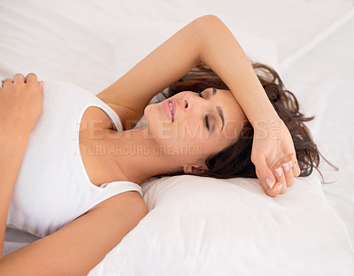 Buy stock photo Woman, tired and sleeping in bed for fatigue, dreaming and relax in home to rest on weekend. Female person, comfort and calm in morning apartment, lazy and nap on blankets for peace or wellness