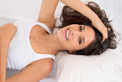 Buy stock photo Portrait, smile and top view of woman on bed in home to relax or resting in the morning. Face, above and happy person in bedroom on comfortable pillow, wakeup or laughing in apartment in Australia