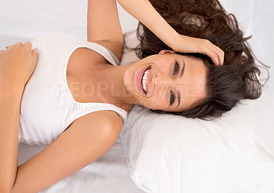 Buy stock photo Portrait, smile and woman in bedroom in home to relax or resting in the morning in house. Face, wakeup and happy person in bed on comfortable pillow, excited and laughing in apartment in Australia