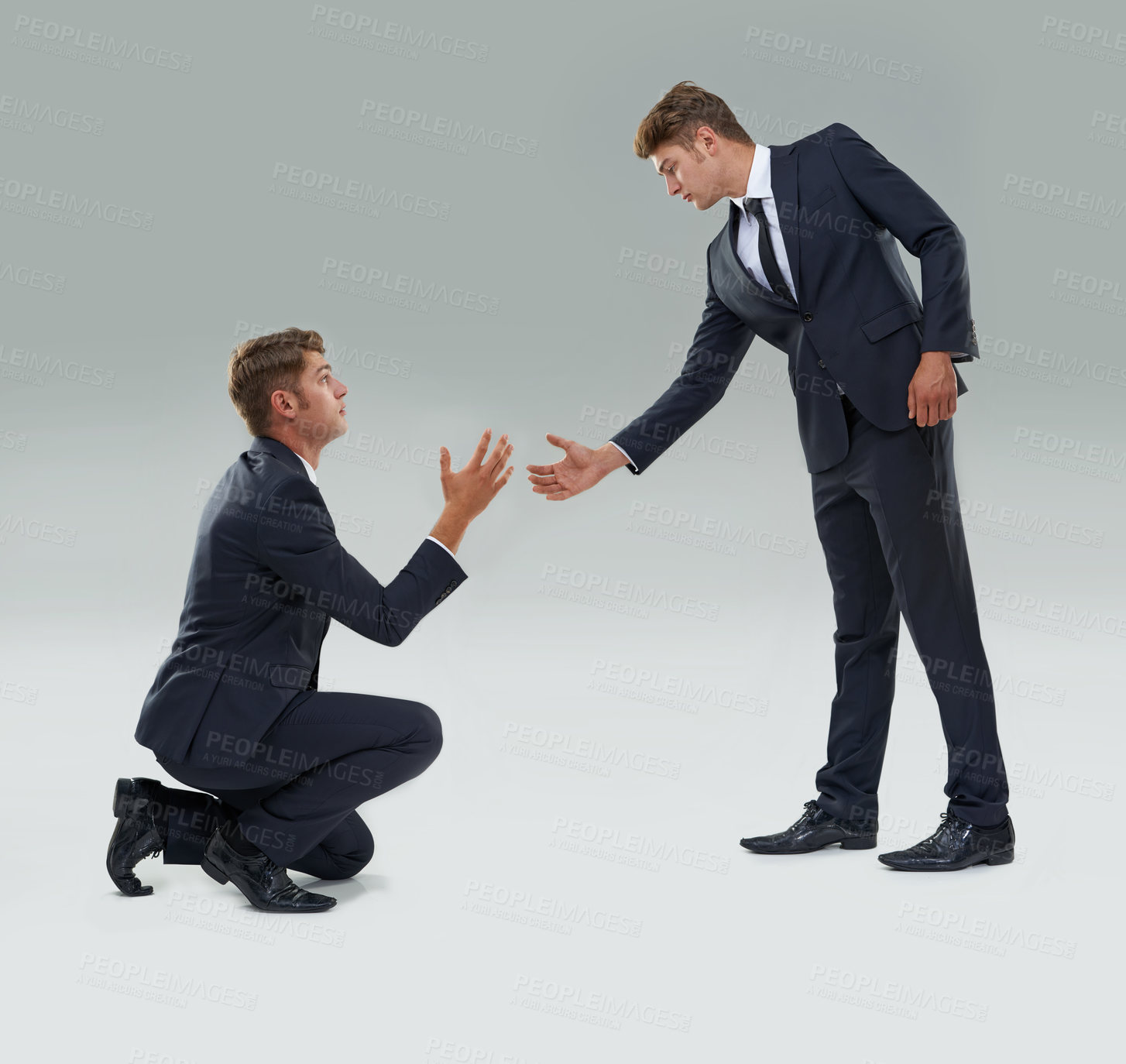 Buy stock photo Assistance, help and teamwork with business man in studio on gray background for aid or support. Collaboration, growth and partnership with young corporate employee giving helping hand to alter ego