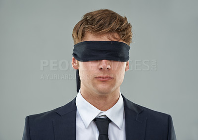 Buy stock photo Cropped view of a young businessman with his eyes blindfolded