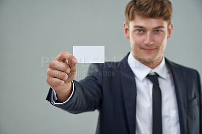 Buy stock photo Professional man, business card and studio with suit, smile and advertisement for logo and brand. Male person, formal and marketing for contact, salesman and career choice for recruitment 