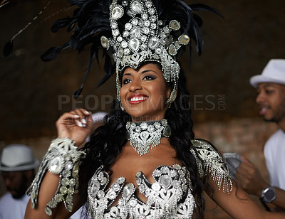 Buy stock photo Dancer, happy and samba performance at night for celebration in Rio de janeiro for carnival season. Female person, costume and feathers for culture and show, creativity and confidence at festival