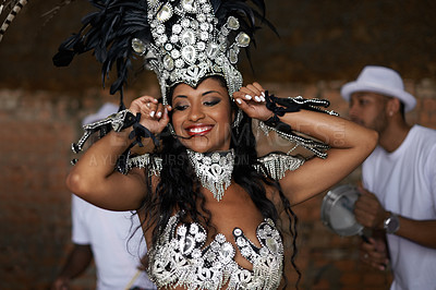 Buy stock photo Woman, happy and samba performance at night for celebration in Rio de janeiro for carnival season. Female person, costume and feathers for culture and life, creativity and confidence at festival