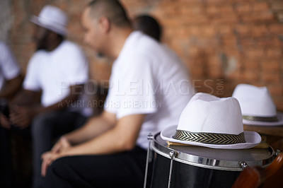 Buy stock photo Band, relax and music with percussion drums on stage, rhythm and men with talent in group. Friends, hats and practice performing in team as professional musician and bonding together for carnival