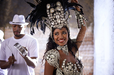 Buy stock photo Woman, band and samba performance at night for celebration in Rio de janeiro for carnival season. Female person, costume and feathers for culture and life, creativity and confidence at festival
