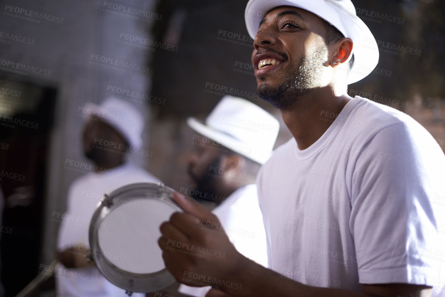 Buy stock photo Shot of a band playing their percussion instruments in a Brazilian setting