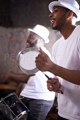 Buy stock photo Music, concert and man with tambourine, percussion instruments and band mate on stage in Sao Paulo. Happy black men, drummer and musician for playing, singing and dancing in night club performance