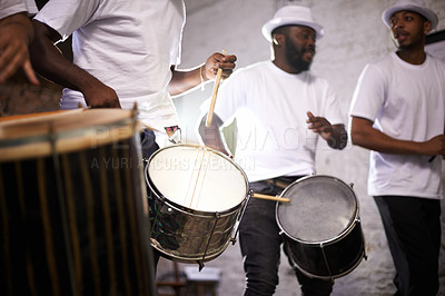 Buy stock photo Shot of a band playing their percussion instruments in a Brazilian setting
