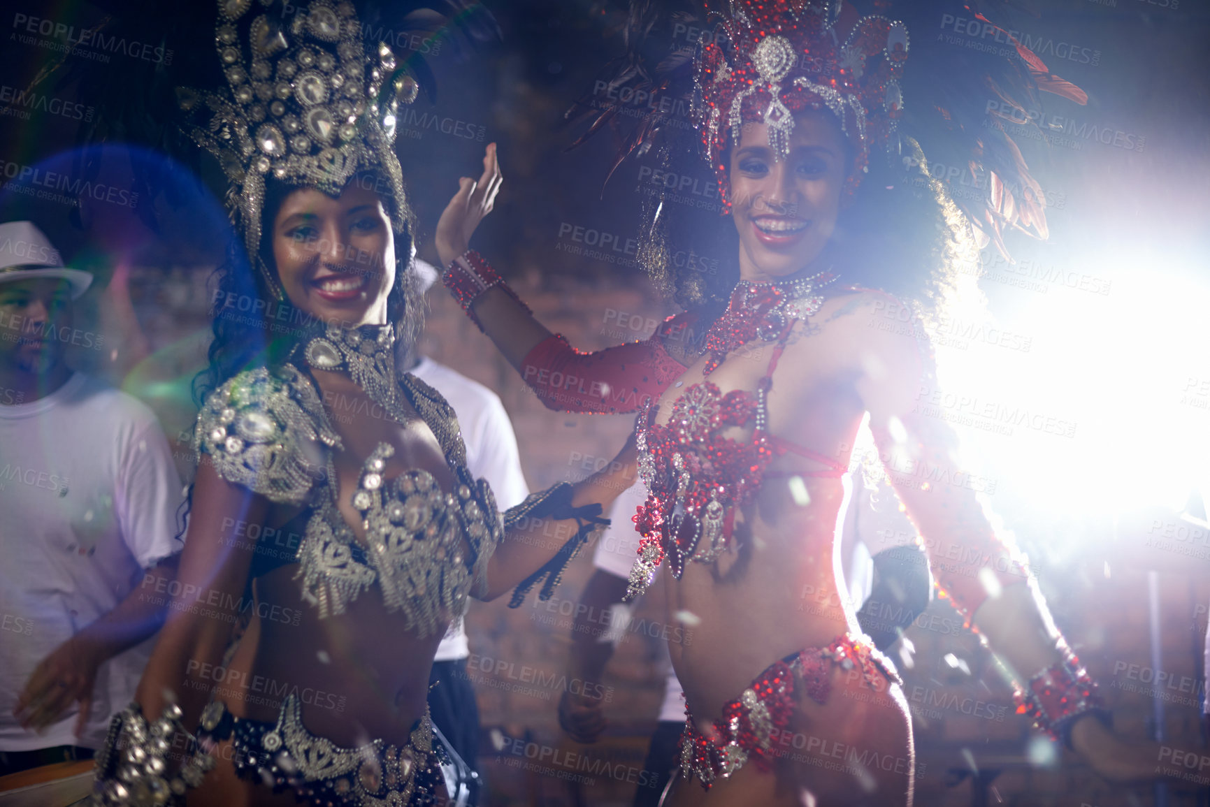 Buy stock photo Portrait, women or dancer with band at carnival in rio de janeiro for brazilian festival with feather costume or smile. People, face or night and dancing, fashion or light for culture or outdoor show