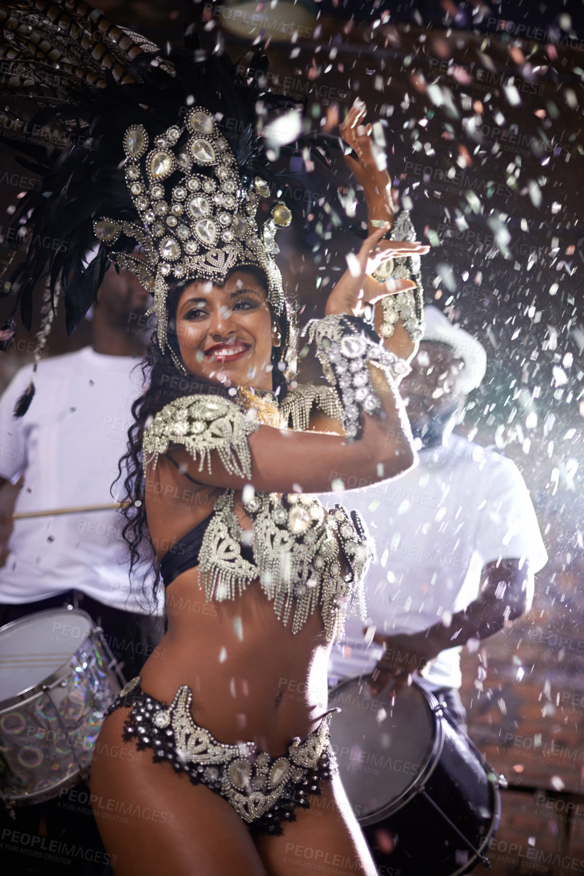 Buy stock photo Carnival, woman and dancing in street with confetti and performance in Brazil, costume and feather head gear outdoor. Music, samba and happy for event, culture with festival entertainment and talent