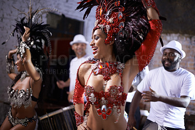 Buy stock photo Happy woman, samba and dance at music festival, carnival or night performance with costume and band. Excited dancer, group and drummer for event, celebration and culture or history in Rio de Janeiro