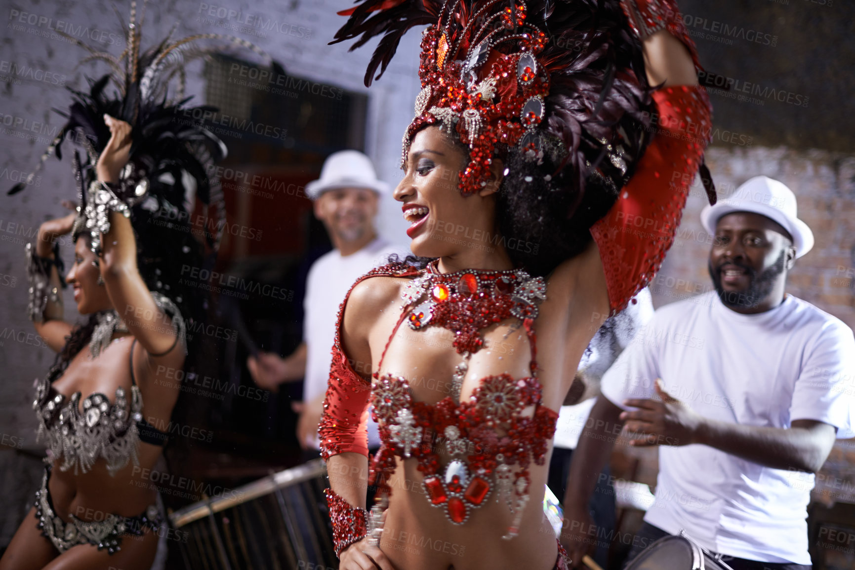 Buy stock photo Happy woman, samba and dance at music festival, carnival or night performance with costume and band. Excited dancer, group and drummer for event, celebration and culture or history in Rio de Janeiro