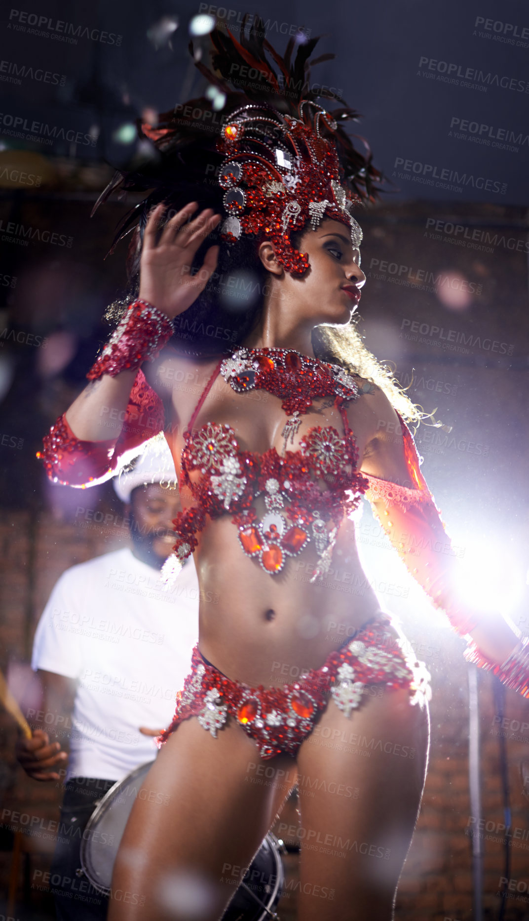 Buy stock photo Shot of a beautiful samba dancer performing in a carnival with her band