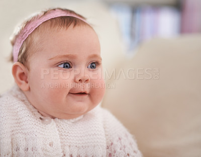 Buy stock photo Happy, baby and face in a home with a calm, relax and sweet infant in a living room. Youth, child and house with toddler clothing in the morning ready for a nap on the sofa with joy and headband