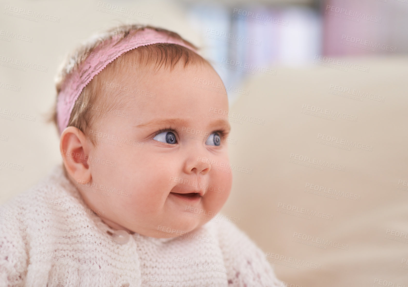 Buy stock photo Happy, baby girl and face in a home with a calm, relax and sweet infant in a living room. Youth, child and house with toddler clothing in the morning ready for a nap on the sofa with joy and headband