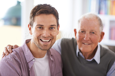 Buy stock photo Portrait of a father and son sitting in their living room