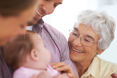 Buy stock photo Family, grandmother with baby and parents for happiness at home, people bonding with love and relationship. Support, trust and care with old woman meeting young child, smile for pride and generations