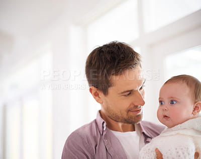 Buy stock photo Father, baby and home with love, support and bonding together with newborn and smile. Happy, family and dad with young child in a living room with parent care in a house carrying a calm infant
