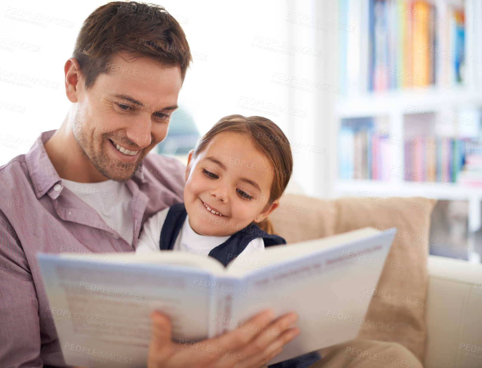 Buy stock photo A father reading a story