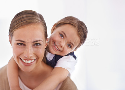 Buy stock photo Closeup portrait of a young mother and her little girl bonding at home