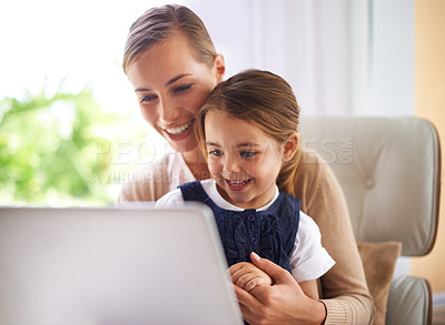 Buy stock photo Laptop, remote education and mother with daughter on sofa in living room of home to study together. School, elearning or homework class with woman parent and girl child in apartment for growth