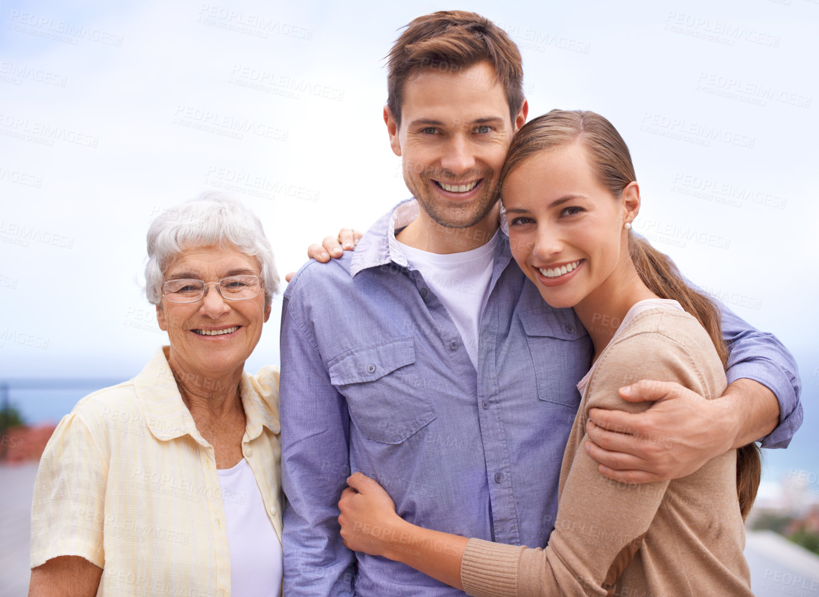 Buy stock photo Happy, family and portrait of mother with couple, husband and wife. Embrace and smiling with love and joy for senior woman at outdoor with bonding on a peaceful day for reunion and affection   