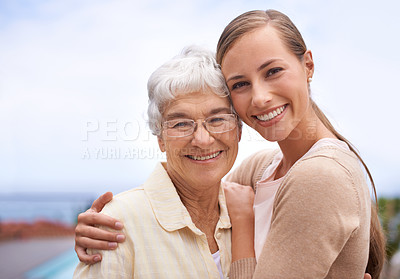 Buy stock photo Portrait of an affectionate mother and daughter standing outdoors