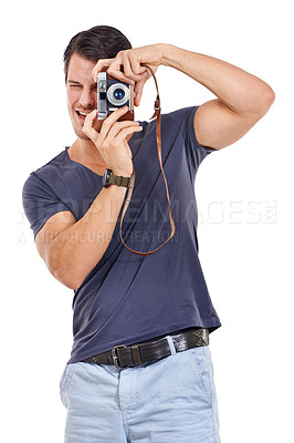 Buy stock photo Photographer, picture and vintage camera with casual man in studio isolated on white background for hobby. Art, creative or media and young photography person with focus lens for photo shoot