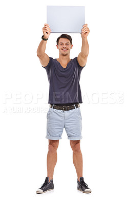 Buy stock photo Studio portrait of a handsome young man holding up a blank sign isolated on white