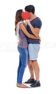 Buy stock photo Kissing, paper and heart with couple, love and marriage isolated on white studio background. Face, man and woman with date, hug or symbol with romance or Valentines day with relationship or embrace