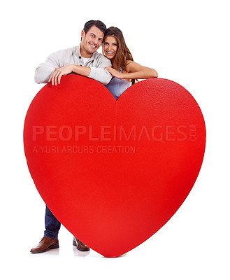 Buy stock photo Couple, smile and love paper in studio for romance, heart and care with portrait and mockup on a white background. Young woman and man with red poster, shape and marketing space for valentines day